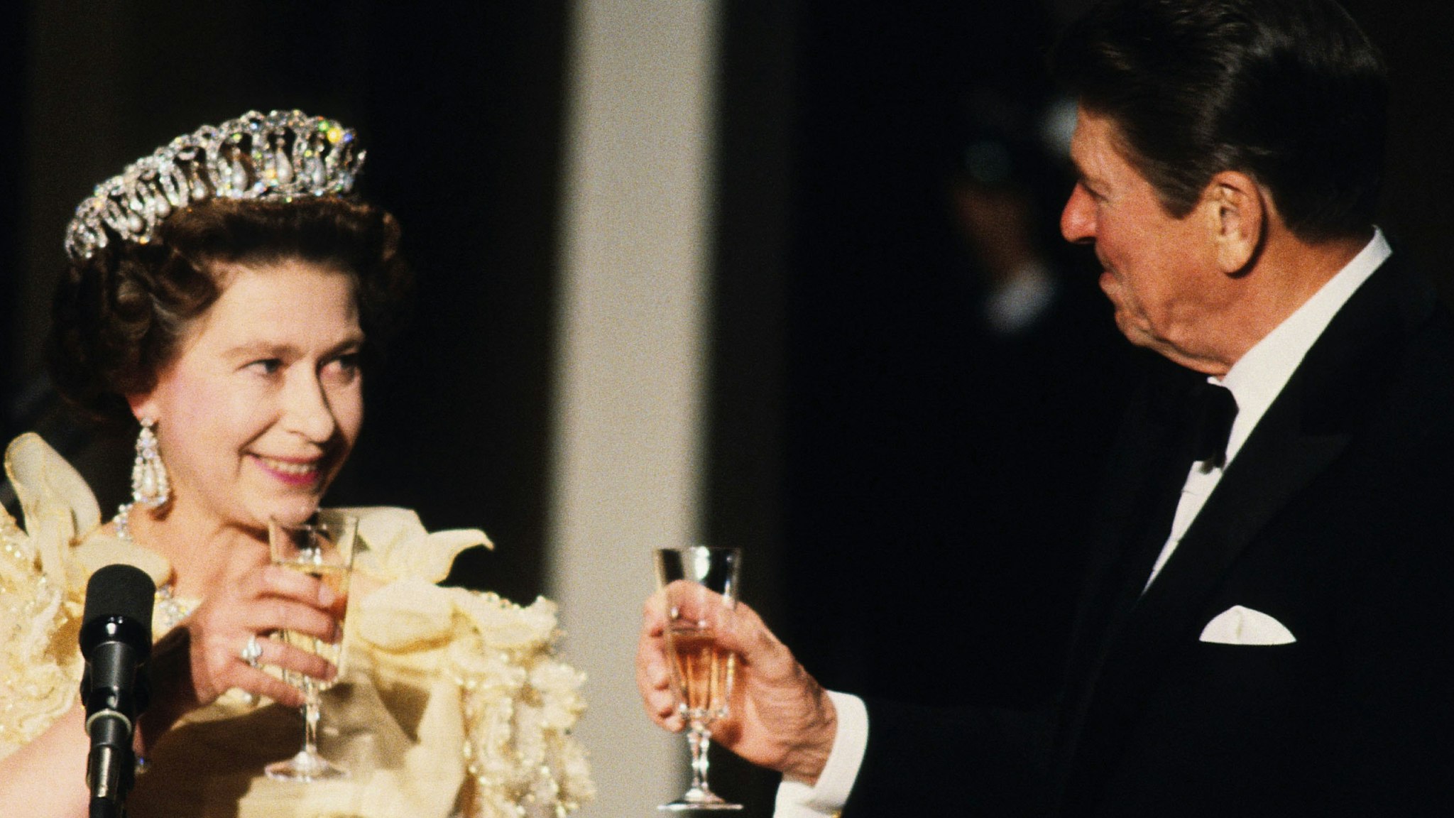 Queen Elizabeth ll toasts President Ronald Reagan at a banquet during the Queen's official visit to the US in March 1983 in in San Francisco, California.