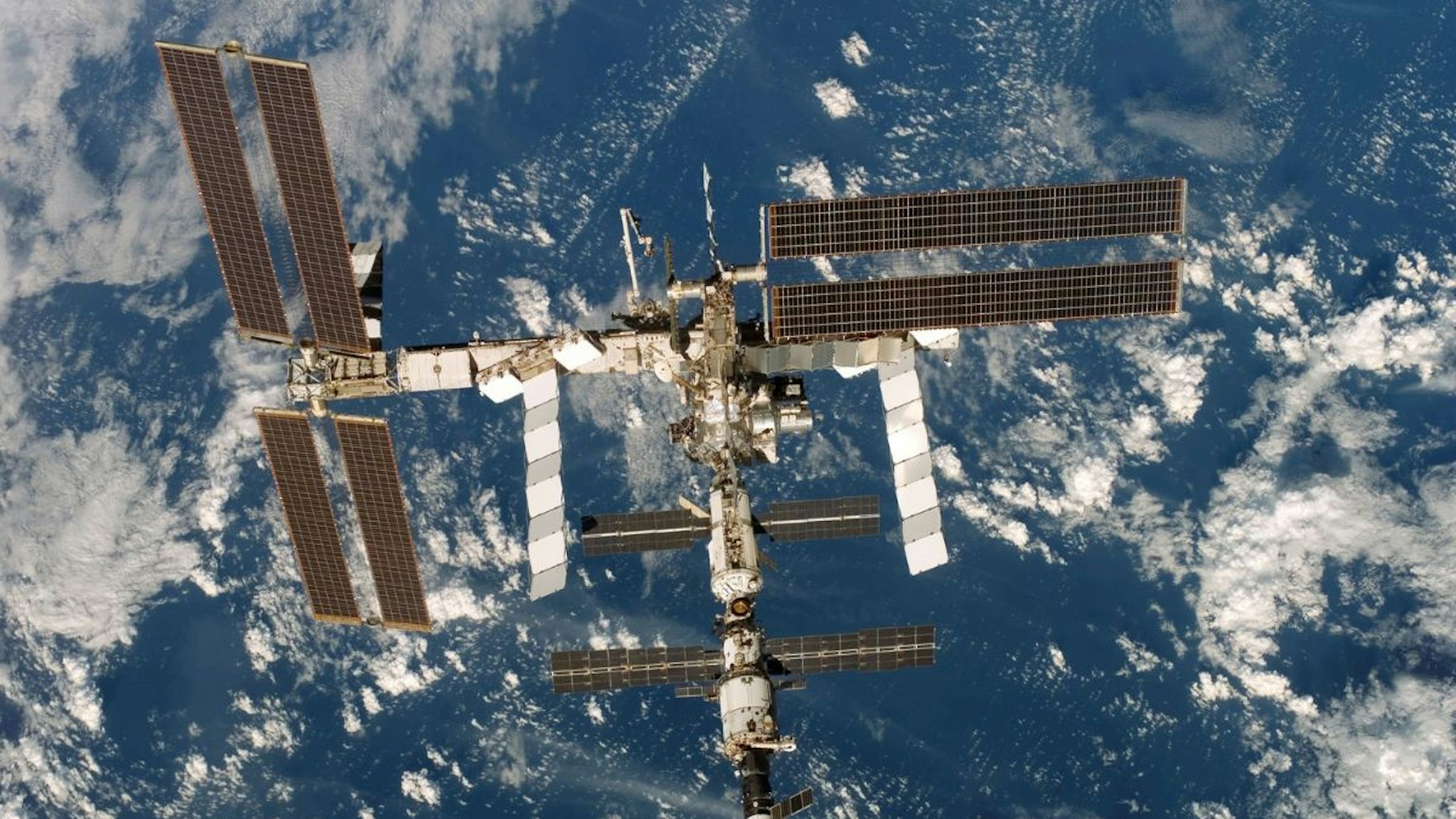 In this handout from NASA, the International Space Station is seen from the Space Shuttle Discovery after undocking from the station December 19, 2006 in orbit around the Earth.
