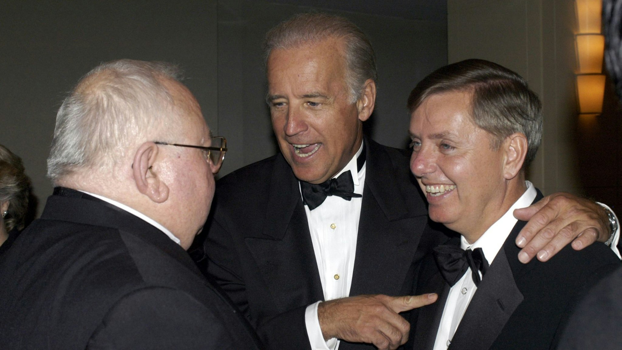 WASHINGTON - APRIL 14: (US TABS AND HOLLYWOOD REPORTER OUT) (L-R) Lee Ewing of Aerospace Daily, U.S. Senator Joseph Biden (D-DE) and U.S. Senator Lindsey Graham (R-SC) attend the American News Women's Club 12th Annual Roast & Toast where Bob Schieffer received the 2004 ANWC Helen Thomas Award For Excellence in Journalism or Outstanding Public Service on April 14, 2004 in Washington, DC.