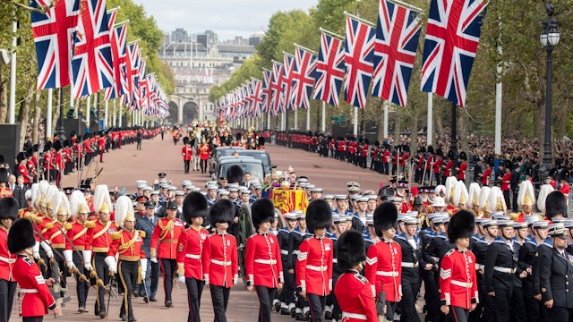 LONDON, ENGLAND - SEPTEMBER 19: The coffin of Queen Elizabeth II is transported along the Mall following the State Funeral of Queen Elizabeth II at Westminster Abbey on September 19, 2022 in London, England. Elizabeth Alexandra Mary Windsor was born in Bruton Street, Mayfair, London on 21 April 1926. She married Prince Philip in 1947 and ascended the throne of the United Kingdom and Commonwealth on 6 February 1952 after the death of her Father, King George VI. Queen Elizabeth II died at Balmoral Castle in Scotland on September 8, 2022, and is succeeded by her eldest son, King Charles III. (Photo by