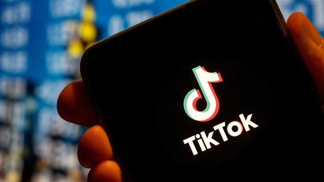 In this photo illustration, the Chinese video-sharing social networking service company TikTok logo is displayed on a smartphone screen.
