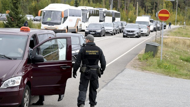 Finnish border guards check a Russian vehicle at the Vaalimaa border check point in Virolahti, Finland, on September 25, 2022.