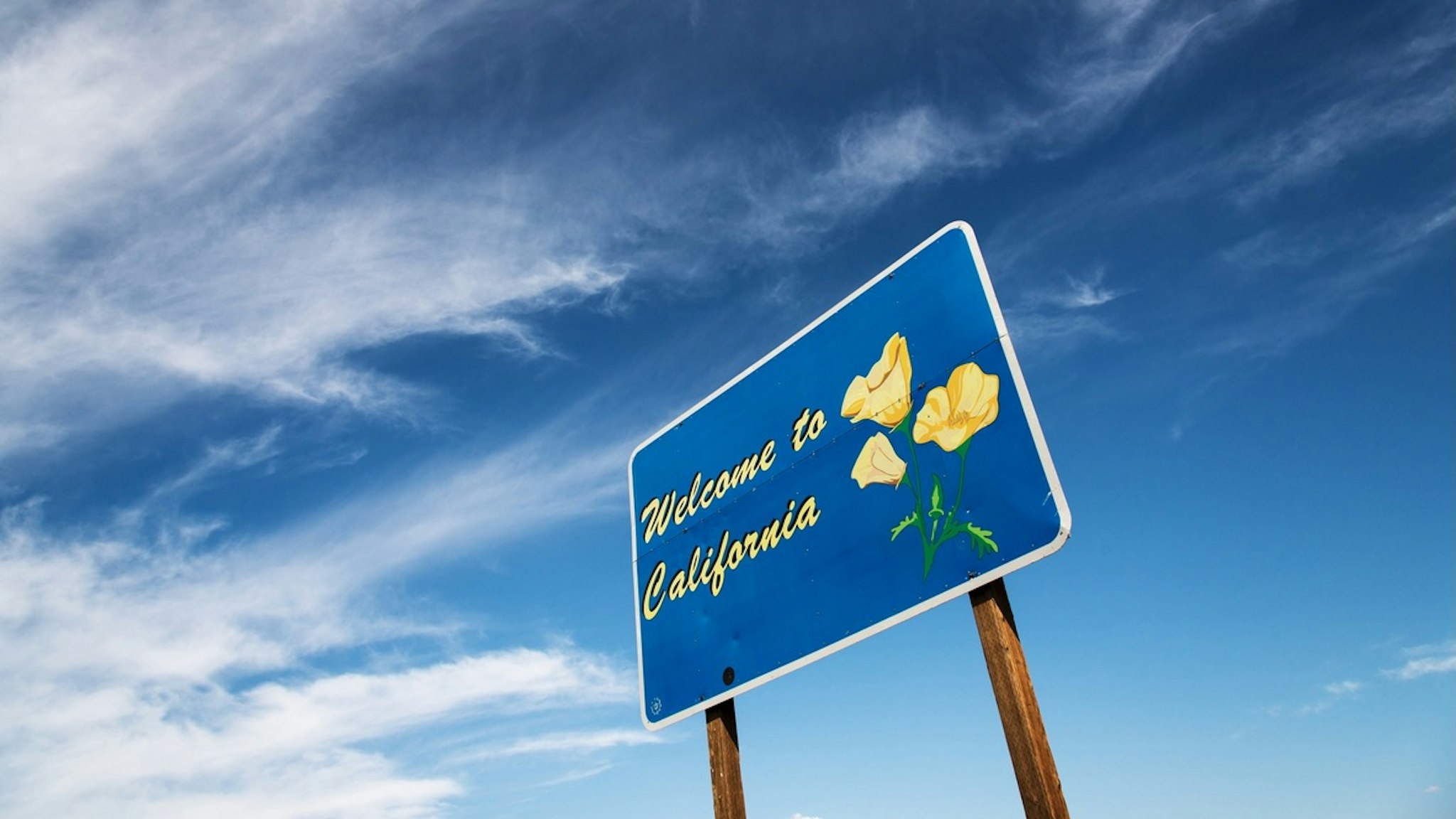 Welcome to California - stock photo Welcome sign to California at the Oregon border. Thomas Winz via Getty Images