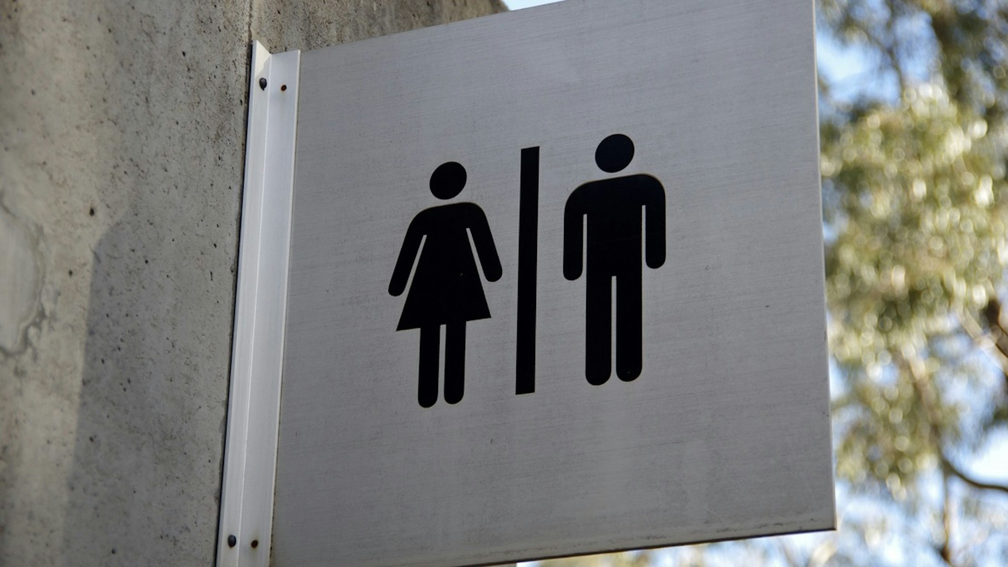 Female and male toilet sign on the exterior of a public restroom block - stock photo Simon McGill via Getty Images