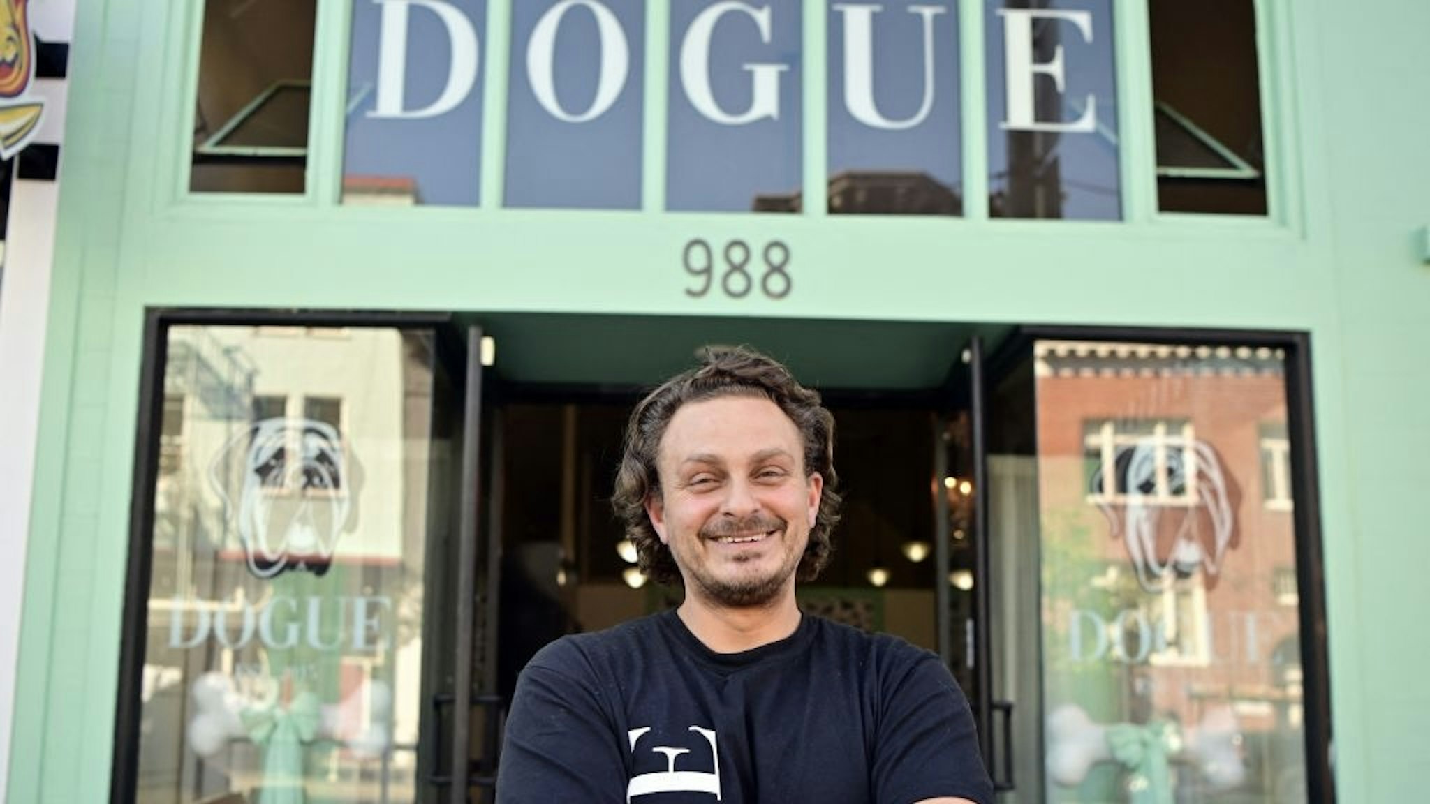 US-ANIMAL-DOG-OFFBEAT Rahmi Massarweh, owner of Dogue, a restaurant for dogs, stands in front of his restaurant in San Francisco, California on October 5, 2022. - Does your dog like fine dining? Does your pooch like posh nosh? Then one US eatery has just the thing. At Dogue in San Francisco, four-legged friends have their pick of the very best foods available, with a menu designed to please even the most exacting canine palate. (Photo by JOSH EDELSON / AFP) (Photo by JOSH EDELSON/AFP via Getty Images) JOSH EDELSON / Contributor