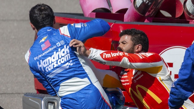 LAS VEGAS, NV - OCTOBER 16: Bubba Wallace (#45 23XI Racing MoneyLion Toyota) shoves Kyle Larson (#5 Hendrick Motorsports HendrickCars.com Chevrolet) after they wrecked in the tri-oval before turn 1 during the NASCAR Cup Series Playoff South Point 400 on October 16, 2022, at Las Vegas Motor Speedway in Las Vegas, NV.