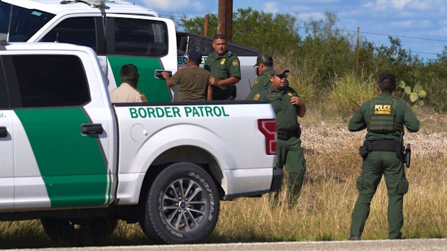 An illegal migrant found smuggled in a vehicle is apprehended by US Border Patrol and the Webb County Sheriff on October 12, 2022 in Laredo, Texas.
