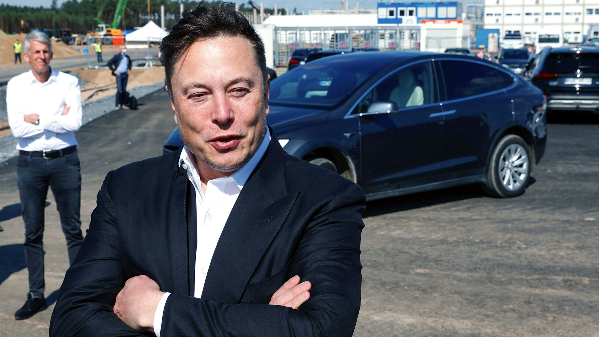 Tesla CEO Elon Musk talks to media as he arrives to visit the construction site of the future US electric car giant Tesla, on September 03, 2020 in Gruenheide near Berlin. - Tesla builds a compound at the site in Gruenheide in Brandenburg for its first European "Gigafactory" near Berlin.