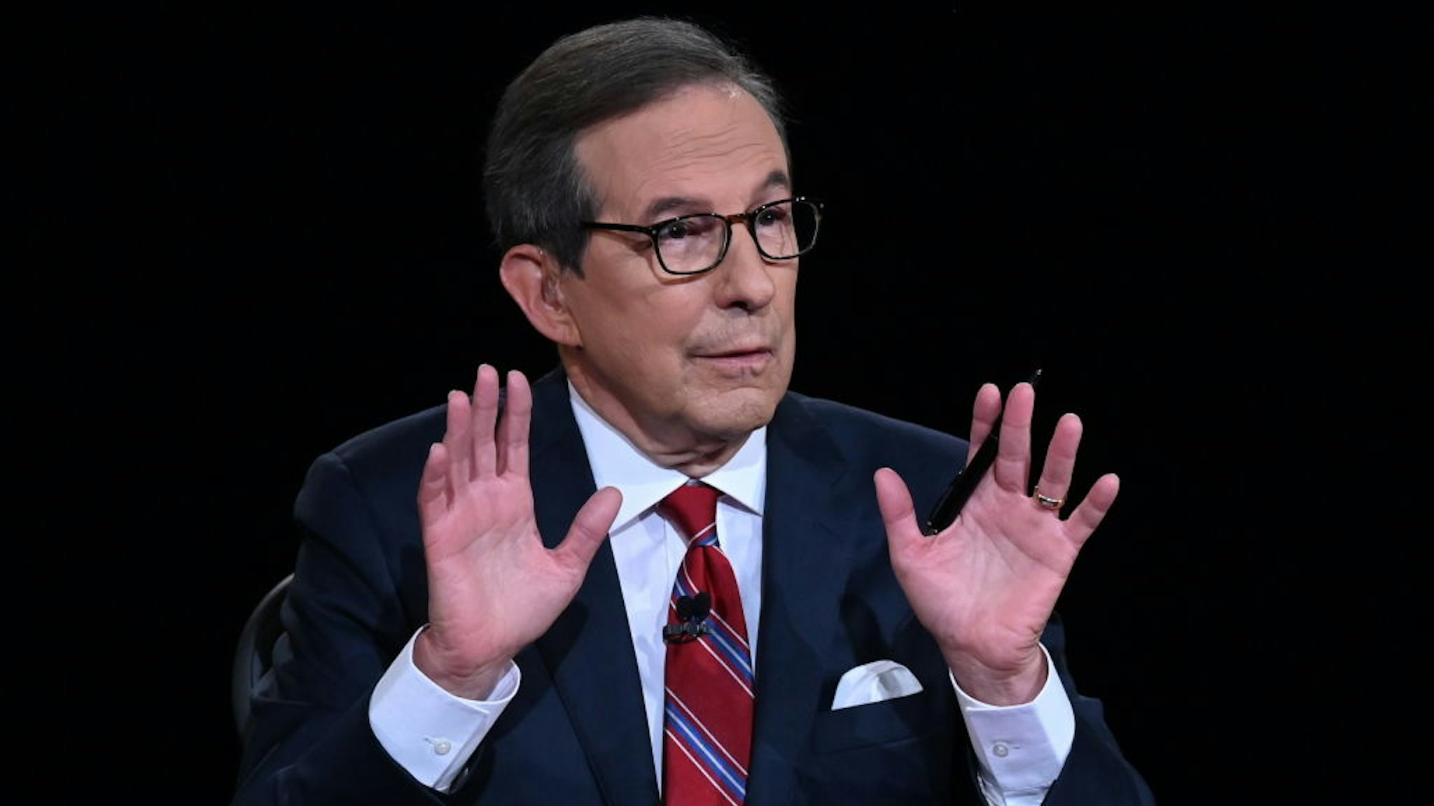 Debate moderator and Fox News anchor Chris Wallace directs the first presidential debate at Case Western Reserve University and Cleveland Clinic in Cleveland, Ohio, on September 29, 2020. (Photo by Olivier Douliery / POOL / AFP) (Photo by OLIVIER DOULIERY/POOL/AFP via Getty Images)