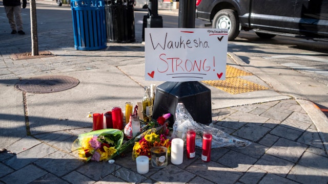 Memorials placed along Main Street in downtown Waukesha Wisconsin left in areas where people were hit by a driver plowing into the Christmas parade on Main Street in downtown November 22, 2021 in Waukesha, Wisconsin.