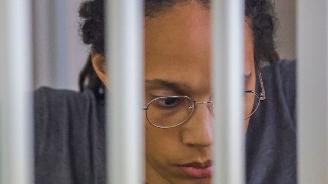 US Women's National Basketball Association (WNBA) basketball player Brittney Griner, who was detained at Moscow's Sheremetyevo airport and later charged with illegal possession of cannabis, sits inside a defendants' cage after the court's verdict during a hearing in Khimki outside Moscow, on August 4, 2022. - A Russian court found Griner guilty of smuggling and storing narcotics after prosecutors requested a sentence of nine and a half years in jail for the athlete. (Photo by EVGENIA NOVOZHENINA / POOL / AFP) (Photo by EVGENIA NOVOZHENINA/POOL/AFP via Getty Images)