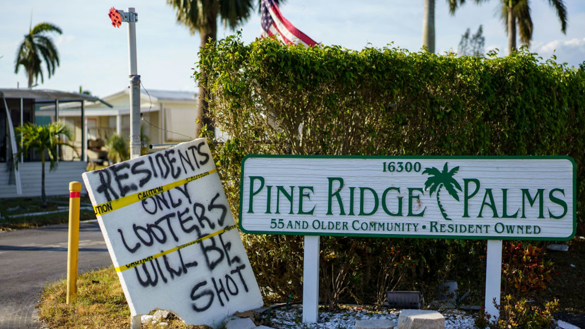 FORT MYERS BEACH FL - OCTOBER 3: A sign warning against looting after Hurricane Ian in the Pine Ridge Palms community of Fort Myers Beach, Fla. (Photo by Thomas Simonetti for The Washington Post via Getty Images)