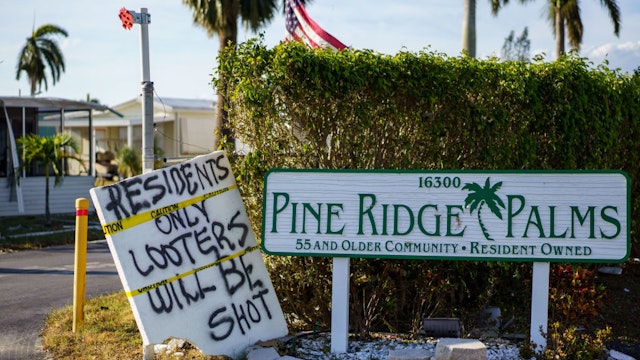 FORT MYERS BEACH FL - OCTOBER 3: A sign warning against looting after Hurricane Ian in the Pine Ridge Palms community of Fort Myers Beach, Fla. (Photo by Thomas Simonetti for The Washington Post via Getty Images)