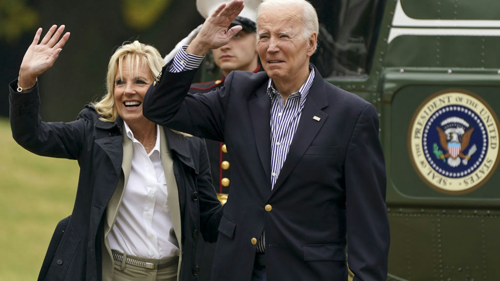 US President Joe Biden and First Lady Jill Biden wave from the South Lawn of the White House before boarding Marine One in Washington, DC, US, on Wednesday, Oct. 5, 2022. Biden will meet with Florida Governor Ron DeSantis today during a tour of areas in his state devastated by Hurricane Ian. Photographer: Leigh Vogel/UPI/Bloomberg via Getty Images