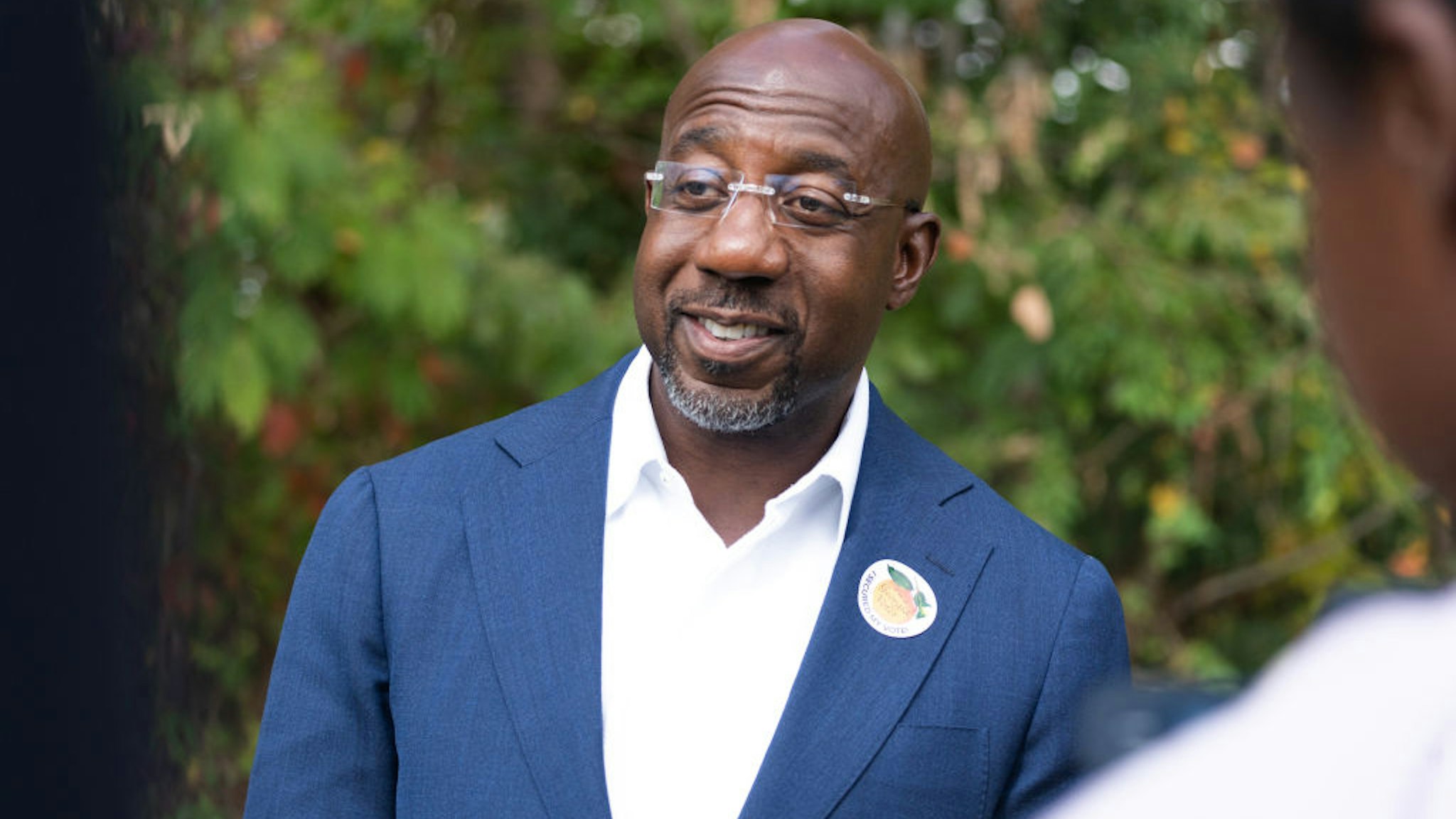 DULUTH, GA - OCTOBER 17: Senator Raphael Warnock (D-GA) meets with community members to encourage them to come out and vote on the first day of early voting on October 17, 2022 in Duluth, Georgia. The Democratic incumbent, Warnock is running against Republican candidate Herschel Walker for the Senate seat in Georgia. (Photo by Megan Varner/Getty Images)
