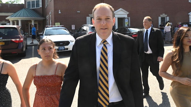 U.S. Congressman Lee Zeldin leaves the Mastic Beach, New York firehouse with his wife Diana and his daughters after casting his vote in the primary election for New York State governor on June. 28, 2022.