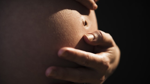 Belly of pregnant woman - stock photo
