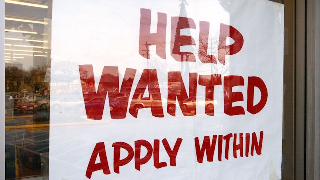 MOUNT PROSPECT, IL - DECEMBER 5: A sign that reads "Help Wanted Apply Within" is seen hanging in a window of a beverage store December 5, 2003 in Mount Prospect, Illinois. The Bureau of Labor Statistics of the U.S. Department of Labor released the November Employment Report today stating employment continued to trend up in November and the unemployment rate, at 5.9 percent, was essentially unchanged from October. Non-farm payroll employment rose slightly over the month to 57,000. (Photo by Tim Boyle/Getty Images)