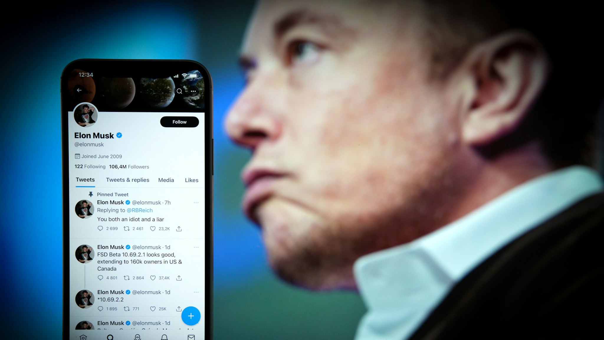 The Twitter profile page belonging to Elon Musk is seen on an Apple iPhone mobile phone in this photo illustration Warsaw, Poland on 21 September, 2022. Also showing a Tweet by Musk hitting out former US Secretary of Labor Rovert Reich over emeral mine accusations.
