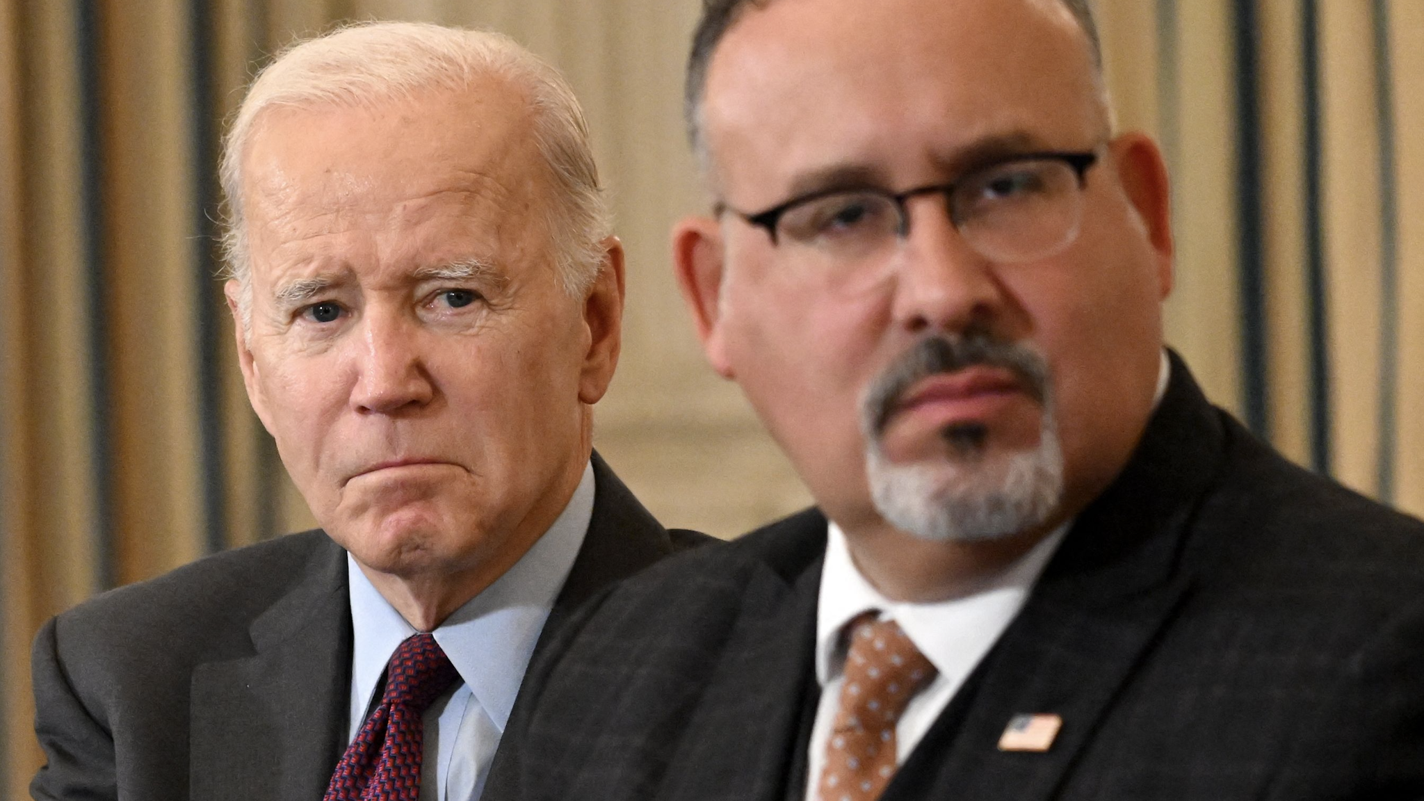 US President Joe Biden, and US Education Secretary Miguel Cardona attend the second meeting of the Task Force on Reproductive Healthcare Access in the State Dining Room of the White House in Washington, DC, on October 4, 2022.