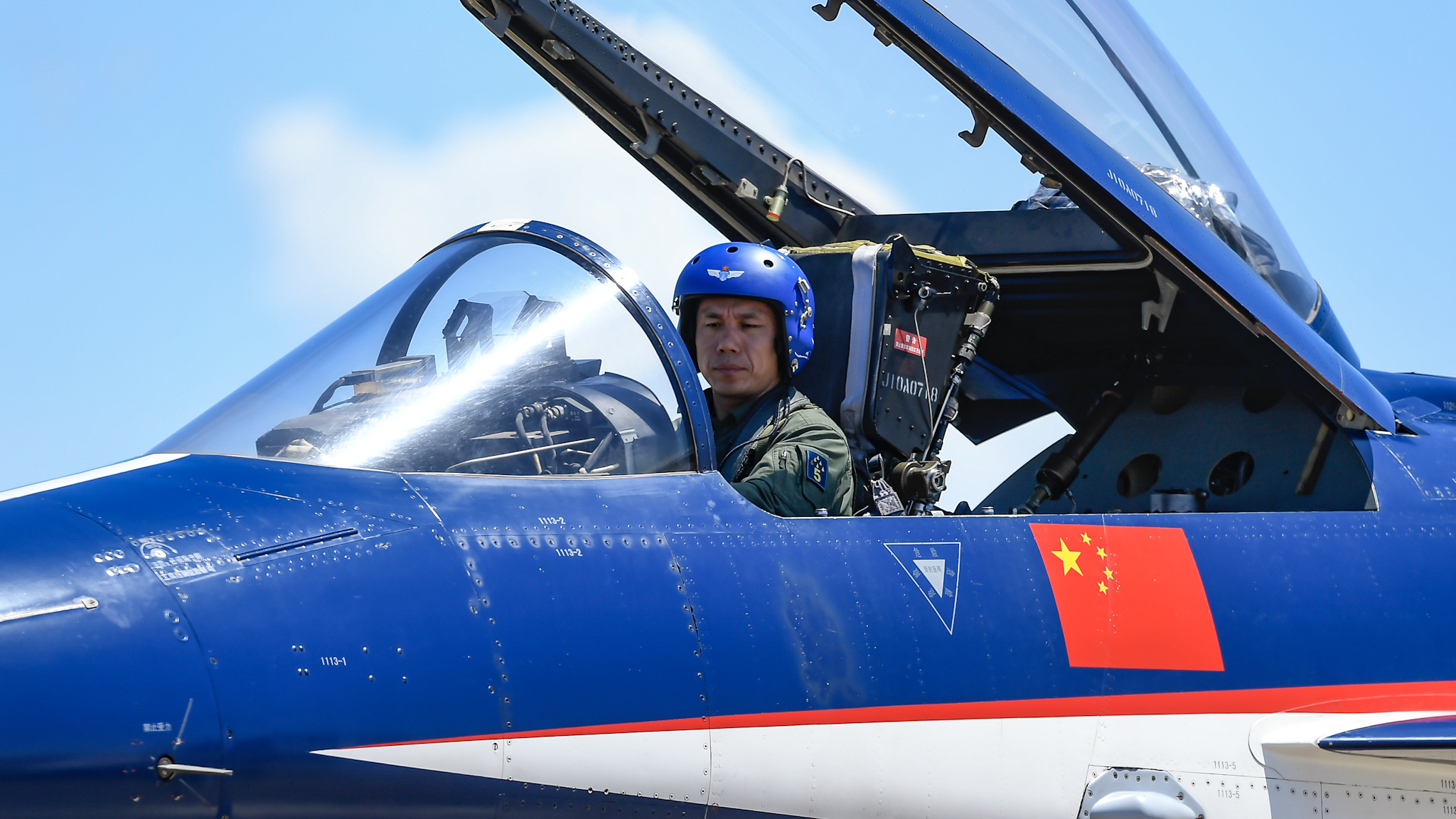 ZHUHAI, CHINA - SEPTEMBER 22: Fighter jet of the Bayi Aerobatics Team of the Chinese People's Liberation Army (PLA) Air Force arrives at Zhuhai International Airshow Center before the upcoming Airshow China 2021 on September 22, 2021 in Zhuhai, Guangdong Province of China.