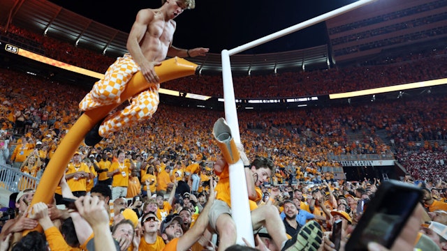 Tennessee Volunteers fans tear down the goal post after the Tennessee Volunteers defeated the Alabama Crimson Tide at Neyland Stadium on October 15, 2022 in Knoxville, Tennessee