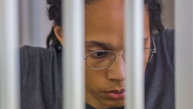 US Women's National Basketball Association (WNBA) basketball player Brittney Griner, who was detained at Moscow's Sheremetyevo airport and later charged with illegal possession of cannabis, sits inside a defendants' cage after the court's verdict during a hearing in Khimki outside Moscow, on August 4, 2022.