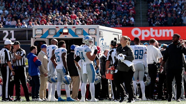 Saivion Smith #29 of the Detroit Lions is taken away in an ambulance after collapsing on the field during the first quarter the New England Patriots at Gillette Stadium on October 09, 2022 in Foxborough, Massachusetts.