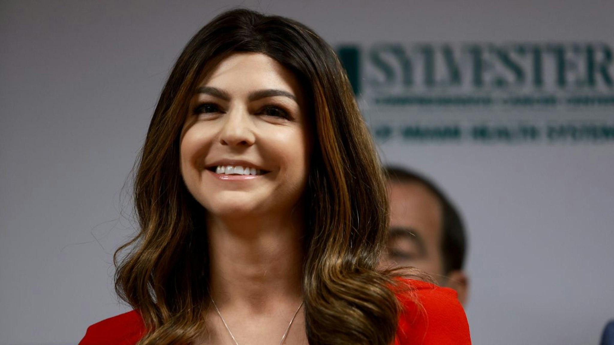 First lady Casey DeSantis, who recently survived breast cancer, listens as her husband Florida Gov. Ron DeSantis speaks during a press conference at the University of Miami Health System Don Soffer Clinical Research Center on May 17, 2022 in Miami, Florida.