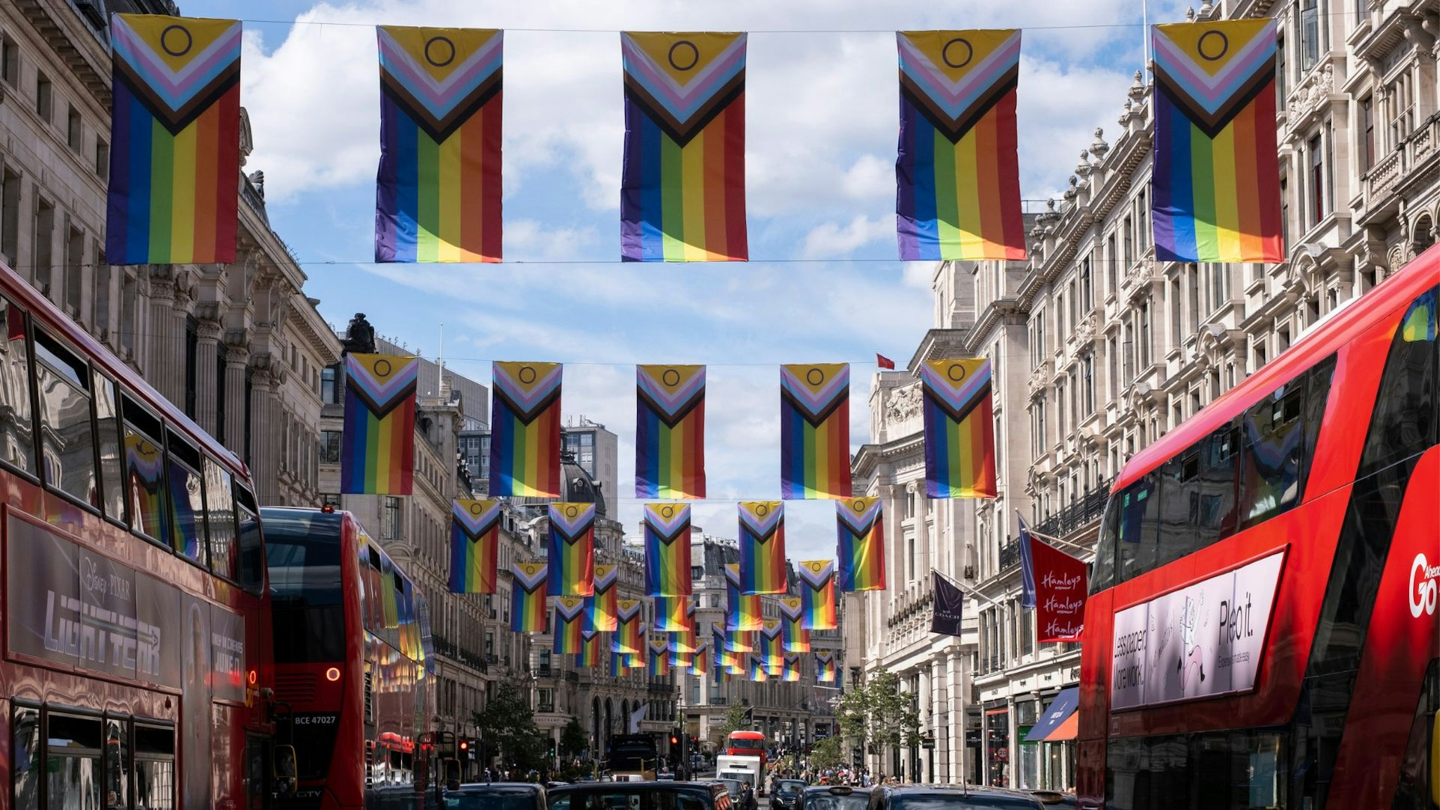 Intersex Inclusive Pride flags high above Regent Street in advance of the Pride in London parade on 28th June 2022 in London, United Kingdom. The flag includes stripes to represent LGBTQ+ communities, with colors from the Transgender Pride Flag, alongside the and circle of the Intersex flag.