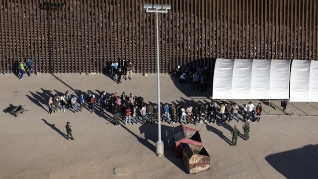 Migrant Border Crossings Into The U.S. Surge To New Record High YUMA, ARIZONA - SEPTEMBER 28: Immigrants await processing by U.S. Border Patrol agents while seeking asylum in the United States on September 28, 2022 near Yuma, Arizona. U.S. immigration authorities made more than 2 million arrests along the U.S. southern border during the 2022 fiscal year, which ends September 30, the first time to reach that historic threshold. (Photo by John Moore/Getty Images) John Moore / Staff