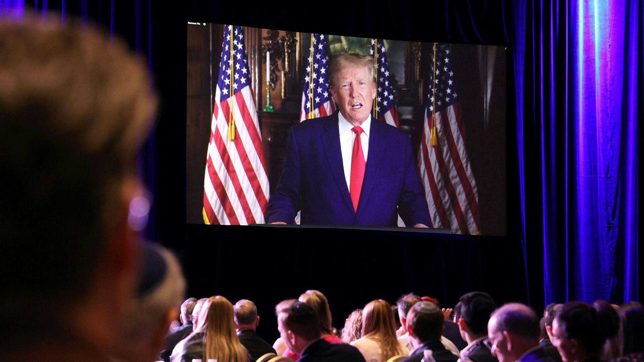 Former US President Donald Trump speaks via video link during the Republican Jewish Coalition (RJC) Annual Leadership Meeting in Las Vegas, Nevada, US, on Saturday, Nov. 19, 2022. Democrats defied political forecasts and historical trends to keep control of the Senate in a win for President Joe Biden, as voters rejected a handful of candidates backed by former President Donald Trump.