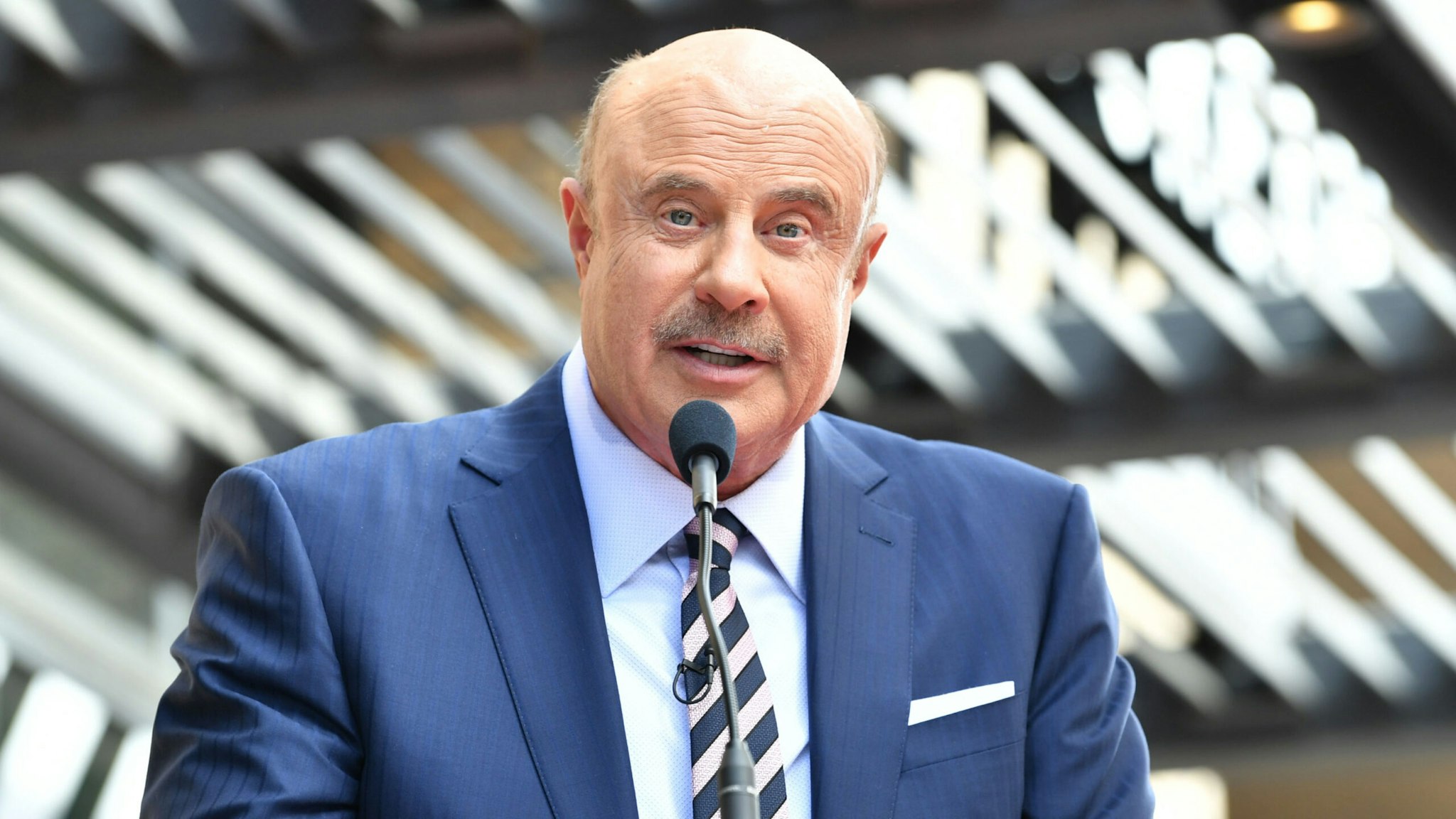 HOLLYWOOD, CALIFORNIA - FEBRUARY 21: Dr. Phil McGraw speaks at the ceremony honoring Dr. him with a star on The Hollywood Walk Of Fame on February 21, 2020 in Hollywood, California.