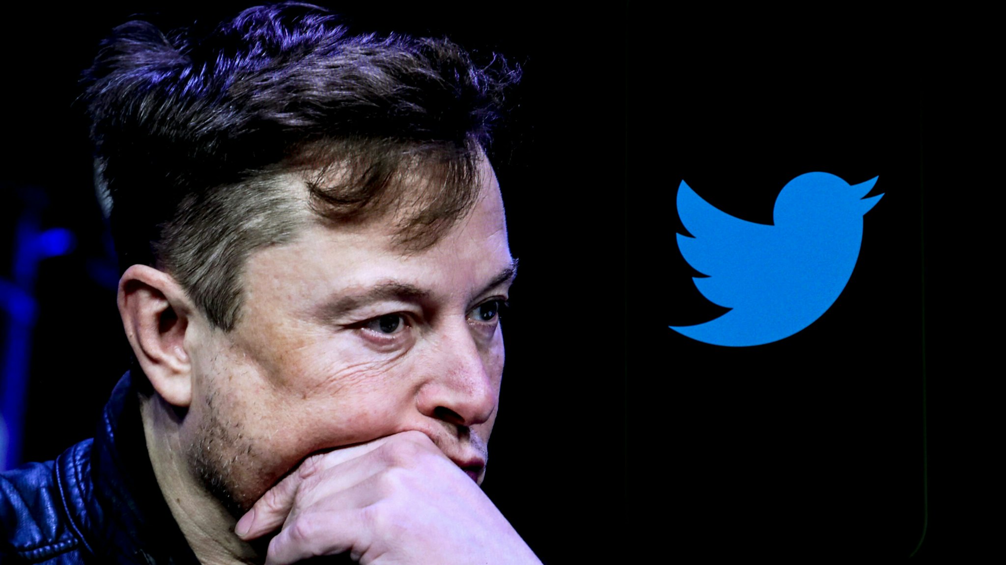 ANKARA, TURKIYE - OCTOBER 06: In this photo illustration, the image of Elon Musk is displayed on a computer screen and the logo of twitter on a mobile phone in Ankara, Turkiye on October 06, 2022.