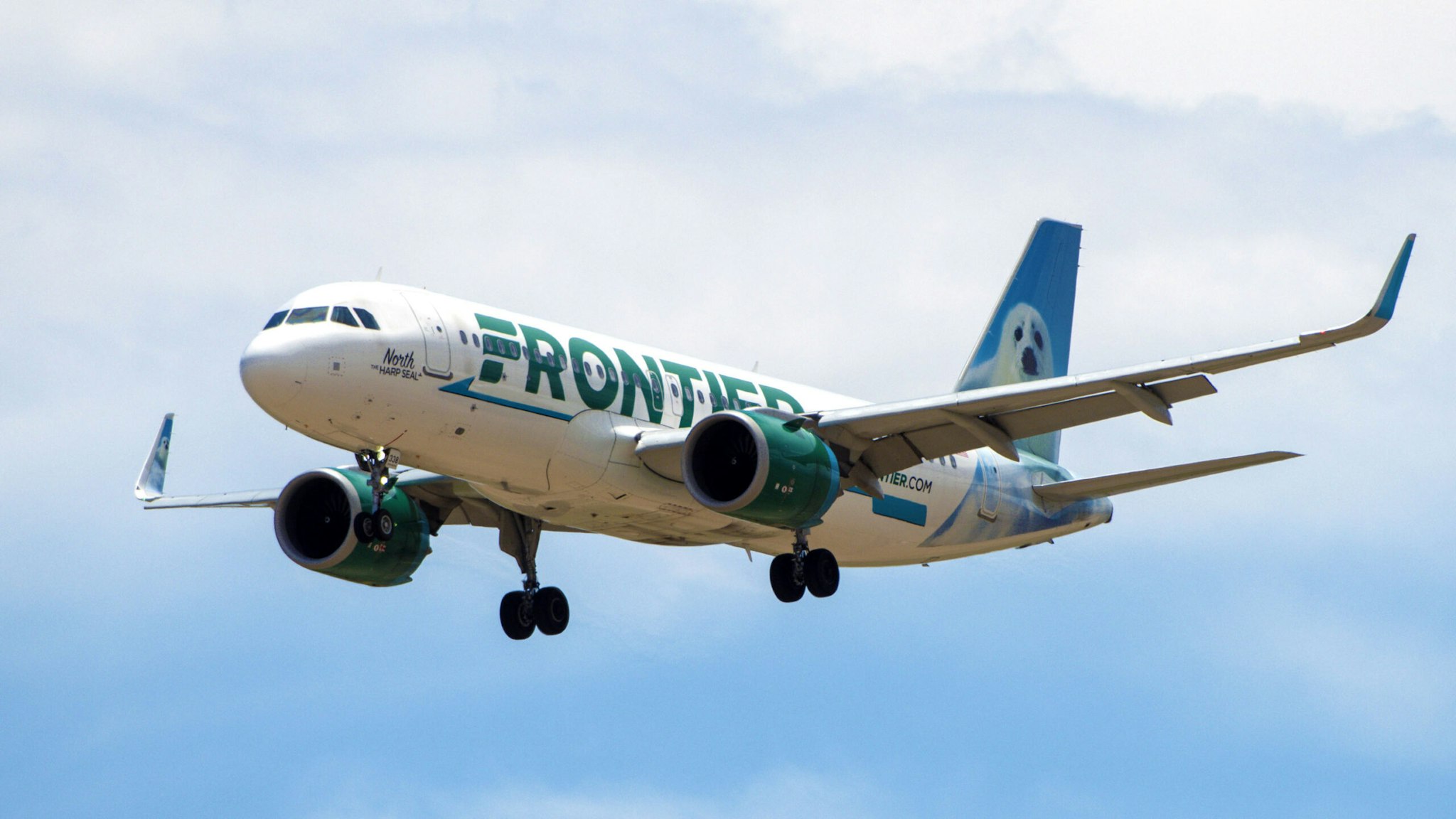 A Frontier Airlines flight prepares to land at Denver International Airport in Denver, Colorado, US, on Wednesday, June 29, 2022. Spirit Airlines Inc. stood by a takeover bid from Frontier Group Holdings Inc. even after rival suitor JetBlue Airways Corp. further sweetened its offer in the final days before a crucial shareholder vote. Photographer