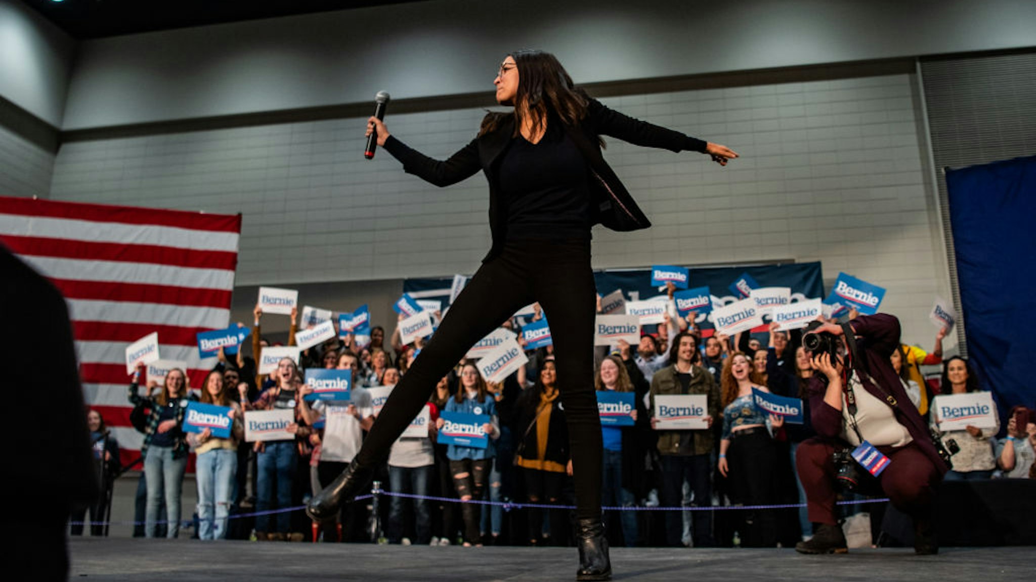 SIOUX CITY, IOWA - JANUARY 26: Alexandria Ocasio-Cortez, D-N.Y., dances on the stage ahead of Sen. Bernie Sanders, I-Vt., 2020 Democratic Presidential Candidate during a rally on Sunday, January 26, 2020 in Sioux City, Iowa. (Photo by