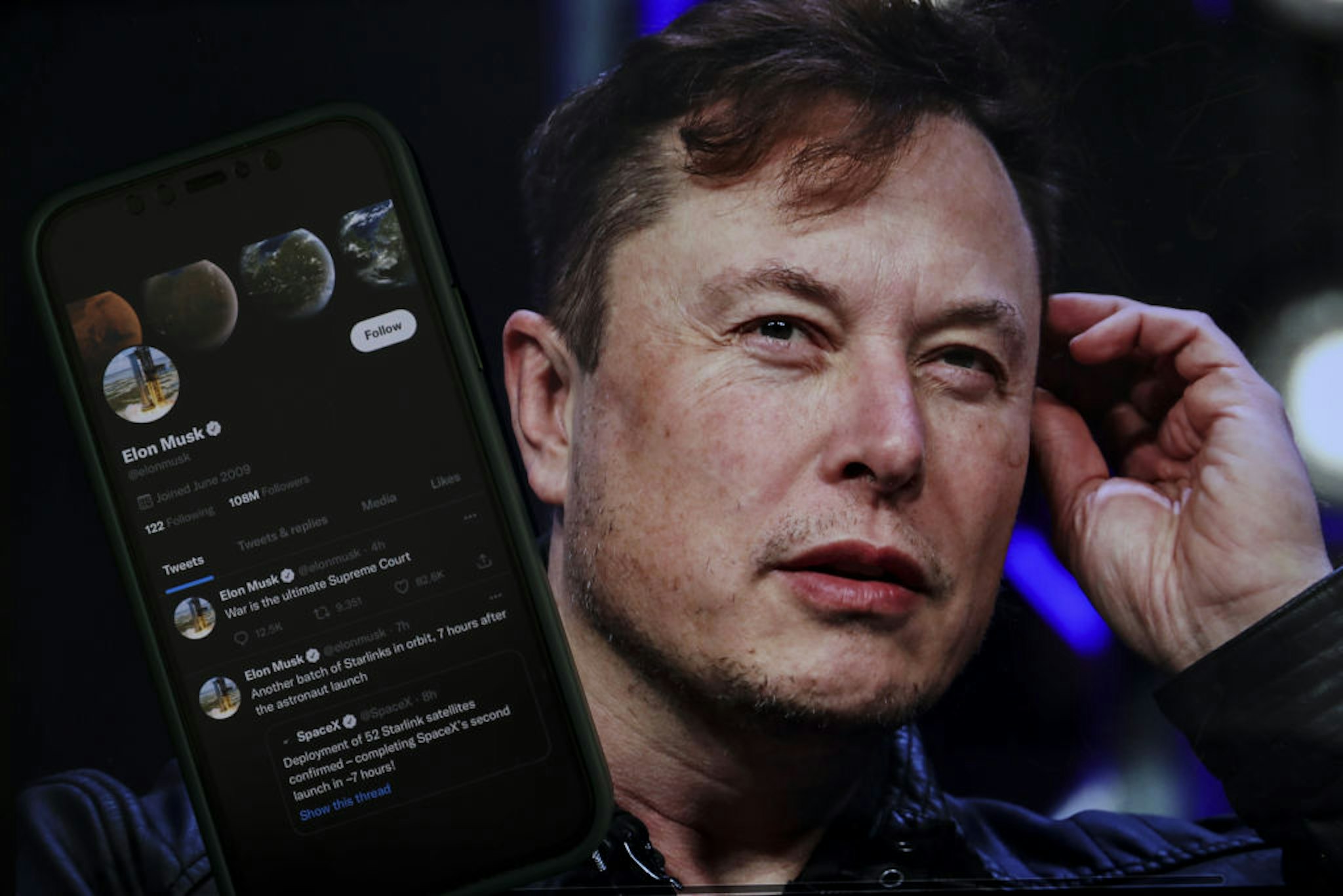 ANKARA, TURKIYE - OCTOBER 06: In this photo illustration, Elon Musk's twitter profile is displayed on a mobile phone and the image of him is seen on a computer screen on back of it in Ankara, Turkiye on October 06, 2022. Muhammed Selim Korkutata / Anadolu Agency