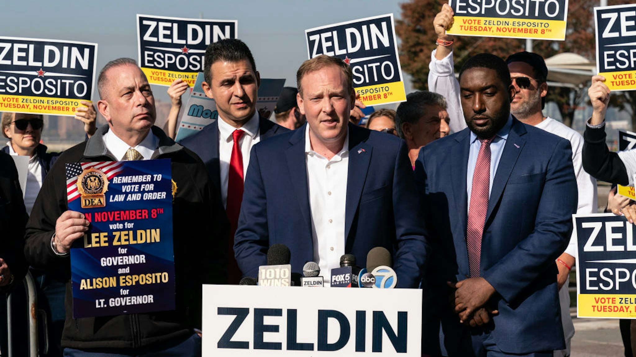 NEW YORK, UNITED STATES - 2022/11/04: Republican candidate for New York Governor Lee Zeldin (C) speaks at a campaign event addressing crimes against women at Pier 45. Zeldin was surrounded by supporters and faced some protesters who shamed him for exploiting the tragedy of a woman raped in that location for political gains. New York police announced that the perpetrator had been arrested. (Photo by Lev Radin/Pacific Press/LightRocket via Getty Images)