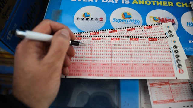 CALIFORNIA, USA - NOVEMBER 7: A person plays Powerball lottery at a 7-Eleven store in Milpitas, California, United States on November 7, 2022.