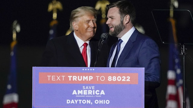 JD Vance, co-founder of Narya Capital Management LLC and US Republican Senate candidate for Ohio, right, talks on stage with former US President Donald Trump during a 'Save America' rally in Vandalia, Ohio, US, on Monday, Nov. 7, 2022. Former President Donald Trump suggested an announcement that he plans to make another White House bid is imminent and attacked Florida Governor Ron DeSantis at a rally in Pennsylvania, a sign the former president is training his ire on a potential chief rival in a 2024 GOP primary. Photographer: Joshua A. Bickel/Bloomberg via Getty Images