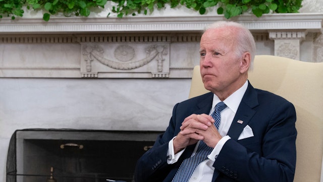 U.S. President Joe Biden listens to Mexican President Andres Manuel Lopez Obrador as they talk to journalists in the Oval Office at the White House on July 12, 2022 in Washington, DC.
