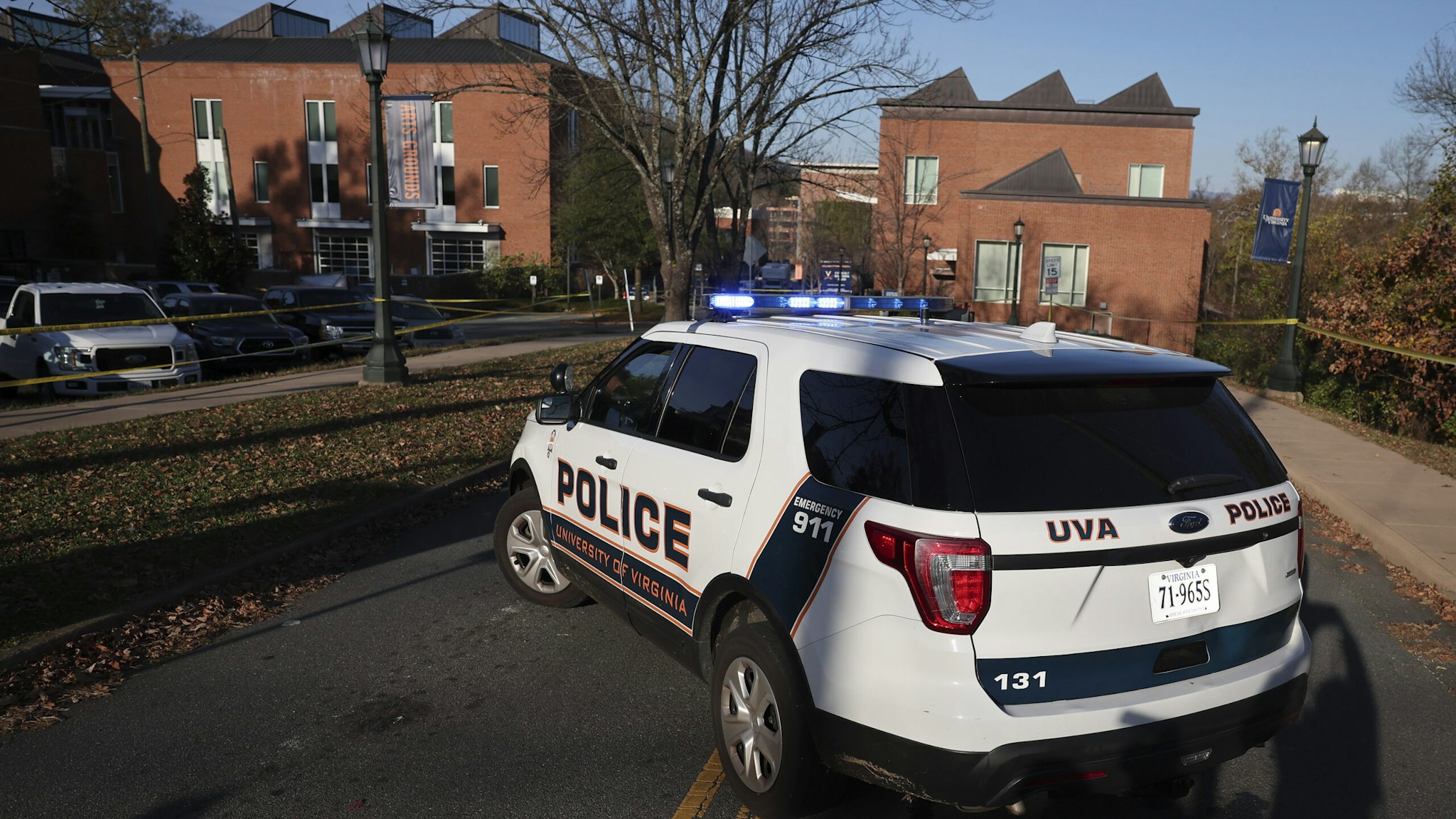 The slain players were identified by school President Jim Ryan as Devin Chandler, Lavel Davis Jr., both wide receivers, and D'Sean Perry, a linebacker and defensive end. Two other students were injured. The shooting prompted a lockdown on the school’s Charlottesville campus while police hunted the suspect throughout the night.
