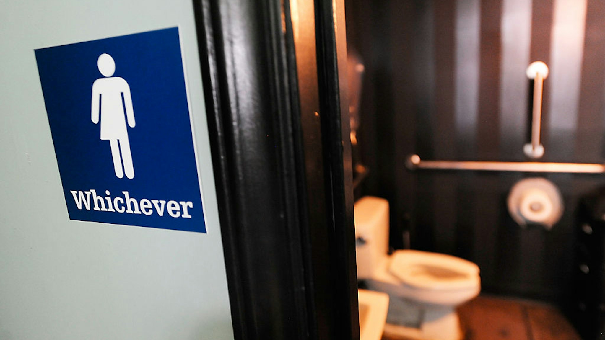 DURHAM, NC - MAY 11: A gender neutral sign is posted outside a bathrooms at Oval Park Grill on May 11, 2016 in Durham, North Carolina. Debate over transgender bathroom access spreads nationwide as the U.S. Department of Justice countersues North Carolina Governor Pat McCrory from enforcing the provisions of House Bill 2 (HB2) that dictate what bathrooms transgender individuals can use. (Photo by Sara D. Davis/Getty Images)