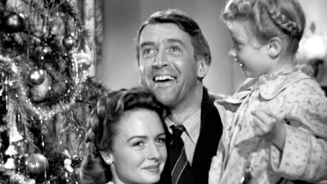 The movie "It's a Wonderful Life", produced and directed by Frank Capra. Seen here from left, Donna Reed as Mary Hatch Bailey, James Stewart as George Bailey and Karolyn Grimes as Zuzu. Premiered December 20, 1946; theatrical wide release January 7, 1947. Screen capture. Paramount Pictures.