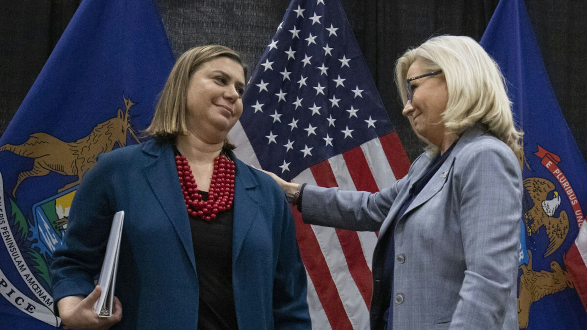 Rep. Liz Cheney (R-WY) (right) campaigns with Rep. Elissa Slotkin (D-MI) at an Evening for Patriotism and Bipartisanship event on November 1, 2022 in East Lansing, Michigan