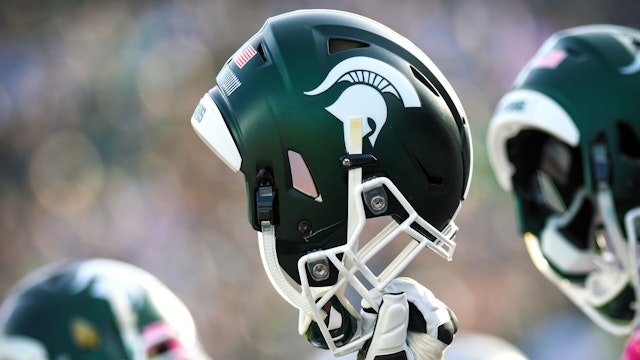 EAST LANSING, MI - OCTOBER 21: A Spartan helmet is raised in the air during the opening kick off of a Big Ten Conference NCAA football game between Michigan State and Indiana on October 21, 2017, at Spartan Stadium in East Lansing, MI. Michigan State defeated Indiana 17-9.