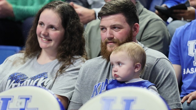 Mollie McGuire , Easton McGuire, Michael McGuire and Linlee McGuire watch the Kentucky Wildcats game against the Duquesne Dukes at Rupp Arena on November 11, 2022 in Lexington, Kentucky.