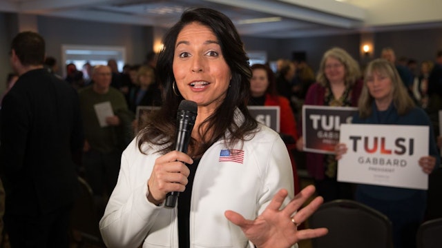 Democratic presidential candidate Rep. Tulsi Gabbard (D-HI) answers media questions following a campaign event on February 9, 2020 in Portsmouth, New Hampshire.