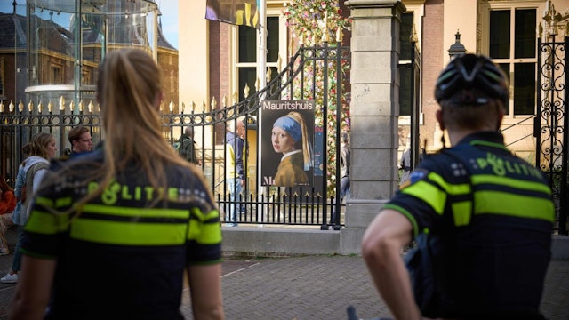 Police stands guard outside the Mauritshuis museum after an attempt to smear the Johannes Vermeer's painting "Girl with a Pearl Earring" in The Hague, 27 October 2022.