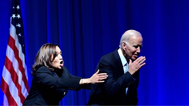 PHILADELPHIA, PA - OCTOBER 28: US President Joe Biden and US Vice President Kamala Harris react while greeting supporters during the Democratic Party's Independence Dinner on October 28, 2022 in Philadelphia, Pennsylvania. Election Day will be held on November 8.